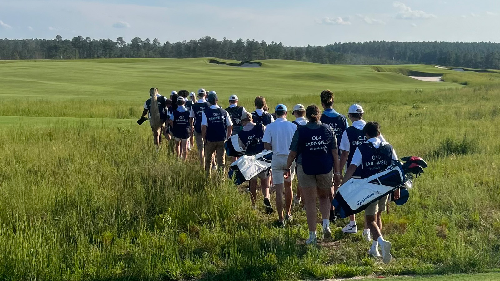 Old Barnwell caddies walking on course